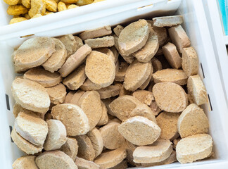 Frozen fish cutlets in the supermarket. Semi products.