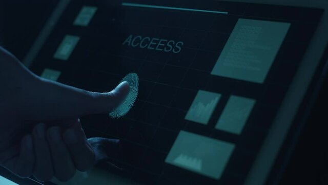 Close up human is touching interface computer monitor, fingerprint biometric identity and approval. future security and password control through fingerprints technology and cybernetic, business