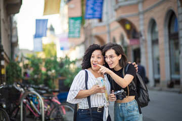 Fototapeta premium Two tourist women on street.