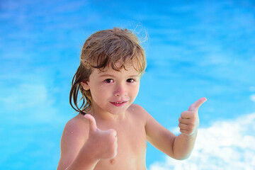 Fototapeta na wymiar Child in summer pool. Boy at aquapark. Kid swimming in pool. Summer activities. Summertime vacation concept.