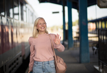  Young woman with suitcase going on vacation.