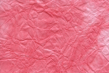 和紙テクスチャー背景(ピンク色)  斑に染めたピンク色の揉み和紙