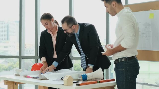 Engineers and architects work on planning, building layout, office blueprints. Brainstorming sessions from experts from many fields Executive director, CEO and manager work meeting