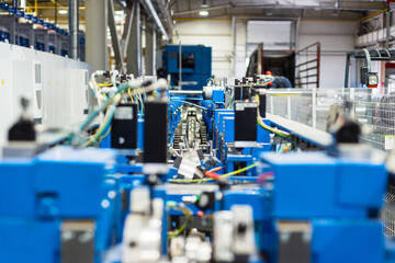 Roller forming machine. The interior of the plant producing a metal profile.
