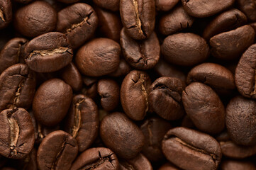 Roasted coffee beans background. Close up top view.