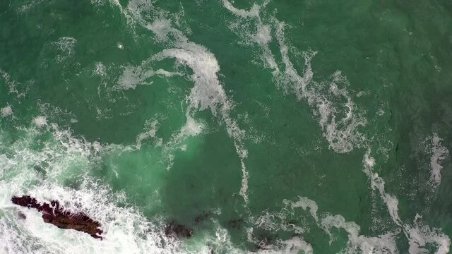 Aerial Shot Of Waves Splashing In Sea, Drone Descending Over Ocean - Manzanita, Oregon