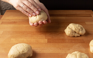 Mother and son making burger buns. Home cooking