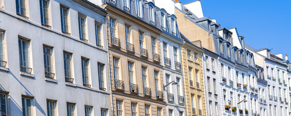 Paris, typical facade in the Marais, detail of the windows
