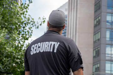 Security guard in uniform patrolling residential area