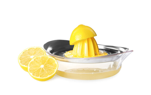Squeezer with juice and lemons on white background