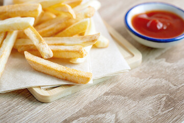 Close up  French Fries with a tomato sauce on the table , fatty unhealthy  junk food concept