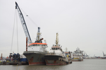 Fototapeta premium Boskalis dredging and cable-laying vessels in the Waalhaven harbor