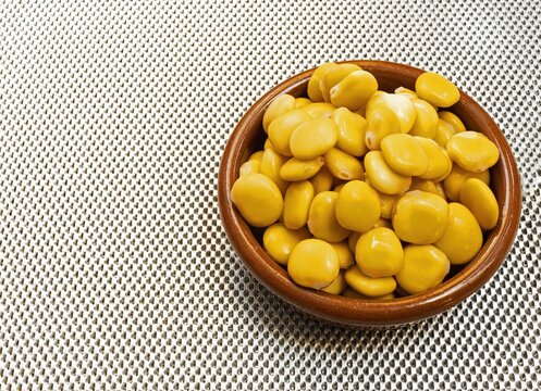 An clay bowl with a lupine, a typical Spanish bar snack