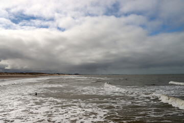 Surfers in the North Sea at Scheveningen