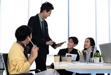 A group of multi sex colleagues, tomboy, transgender and lesbian businesspeople working together...
