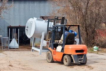 transportation of a new concrete mixer by forklift © Temir