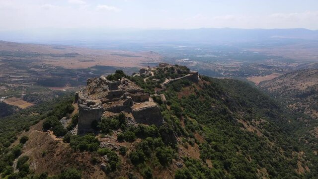 Aerial Panning Shot Of Nimrod Fortress And Scenic Landscape Against Sky - Nimrod Fortress National Park, Israel