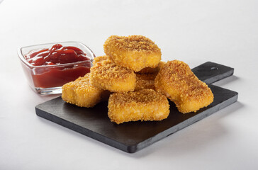 Chicken nuggets. Fried cooked chicken nuggets. Nuggets with a crispy crust.