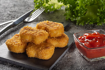 Chicken nuggets. Fried cooked chicken nuggets. Nuggets with a crispy crust.