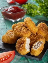 Chicken nuggets. Fried cooked chicken nuggets. Nuggets with a crispy crust.