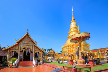 Fototapeta premium Golden pagoda at Wat Phra That Haripunchai Woramahawihan in Lamphun, north of Thailand