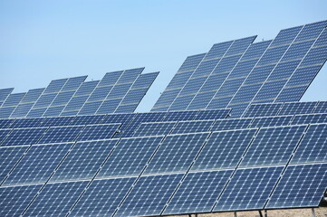 Almaty, Kazakhstan - 03.11.2016 : Solar panels of different sizes are lined up in a row to collect energy.