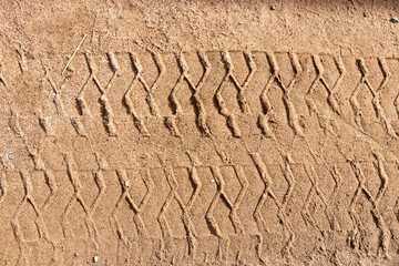 background of tire track mark in the sand