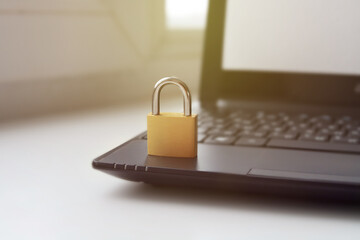 Padlock on laptop, internet data security concept