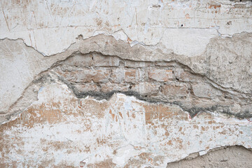 peeling wall texture with exposed brick old masonry