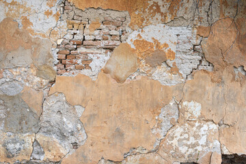 peeling wall texture with exposed brick old masonry
