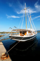 Tiyristic boat on the Aegeen Sea. Beautiful summer day in typical Greek island, Europe