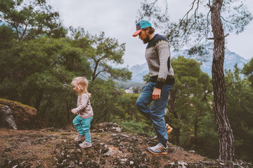 Father and child daughter traveling hiking together family vacation adventure lifestyle outdoor in forest