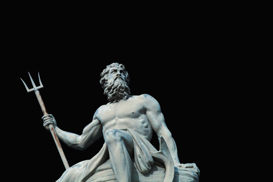 The mighty god of sea and oceans Neptune (Poseidon) The ancient statue against black background.