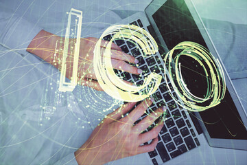 Double exposure of woman hands working on computer and blockchain theme hologram drawing. Top View. bitcoin cryptocurrency concept.
