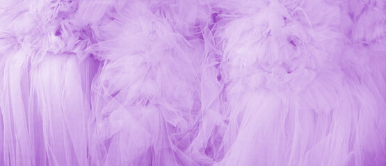Beautiful folds of transparent violet fabric. Textile texture.