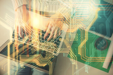 Double exposure of woman hands working on computer and world map hologram drawing. Top View. International business concept.