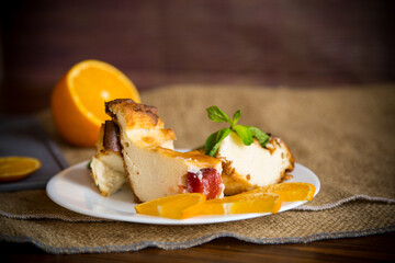 Sweet curd casserole with fruits in a plate