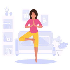A woman practices yoga at home in an apartment. The yoga pose is called 