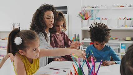 Teacher drawing with kids.
