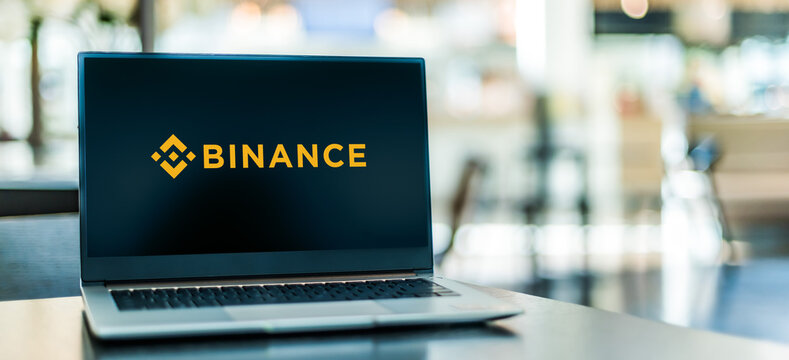 Laptop computer displaying logo of Binance
