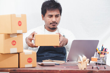 SME entrepreneurs use smartphones to contact customers Work from home to fulfill customer orders through online business websites. Parcel delivery concept
