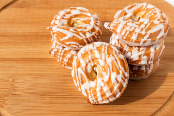 Sweet fresh tasty fondant cookies on a wooden kitchen board. 