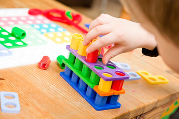 Kids hand on figures. Learning to  count through the game. Tool to easy learn add and subtract,...