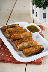 deep fried spring roll with sweetened lemon coriander fish sauce 