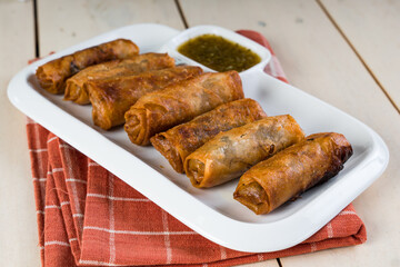 deep fried spring roll with sweetened lemon coriander fish sauce 