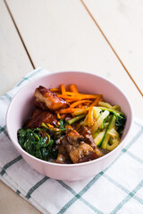 a gourmet mix of chicken karaage and pork soy sauce in kimbap