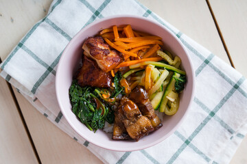 a gourmet mix of chicken karaage and pork soy sauce in kimbap