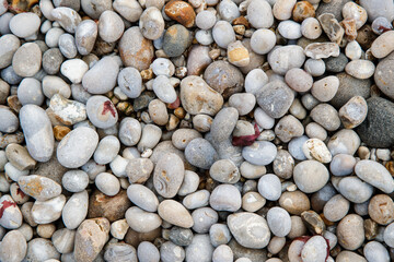 Nature background from beach pebbles, Etretat, France