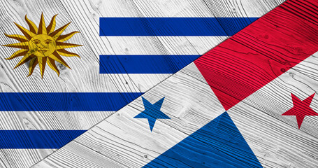 Flag of Uruguay and Panama on wooden planks