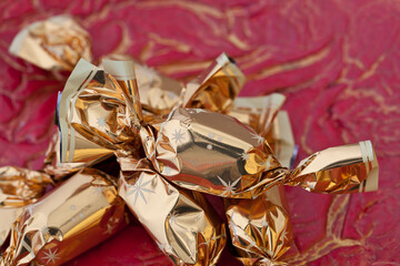 Traditional Golden Christmas Candies On Red